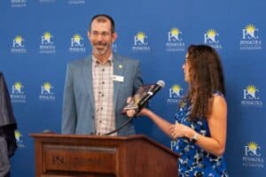 Pensacola State College Foundation Board of Governors President Jennifer Del Gallo thanks Immediate Past President Mike Morette for his two consecutive years as president.